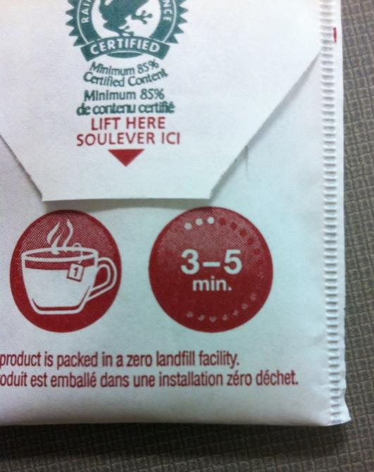 The back of a teabag with text "LIFT HERE" and a graphic showing the teabag in a cup with a numeral 1 and another graphic with the text "3-5 MIN."